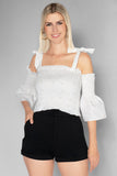 Blusa crop con tirantes y mangas